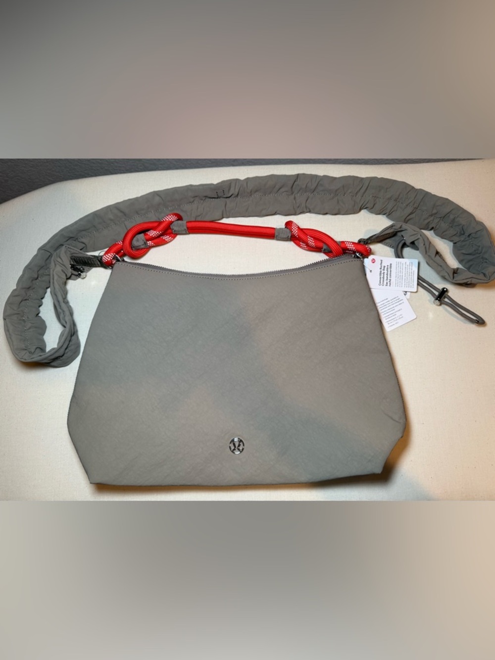 Lululemon Convertible Ruched Crossbody Bag 6.5L. Warm Ash Grey/Sunburst Orange